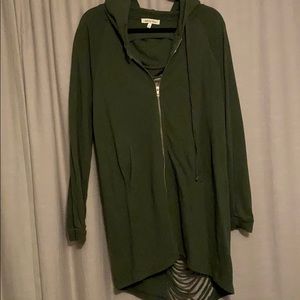 Green sweatshirt with ripped back